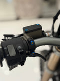 DevMoto Ultra Bee brake mount with titanium bolts, close-up of lightweight, durable motorcycle brake component and fasteners.