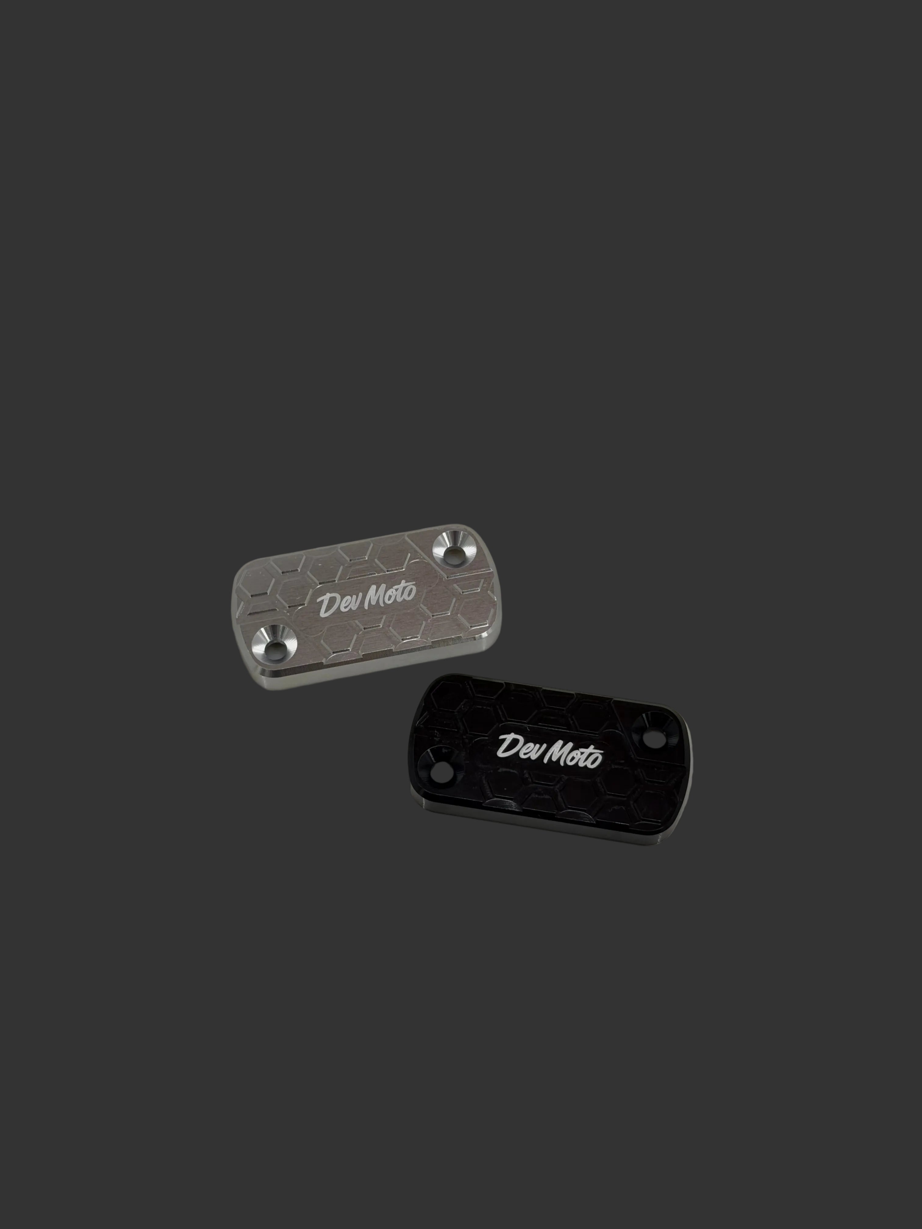 DevMoto Ultra Bee brake reservoir cap with detailed design, fits motorcycle brake systems for secure fluid containment.