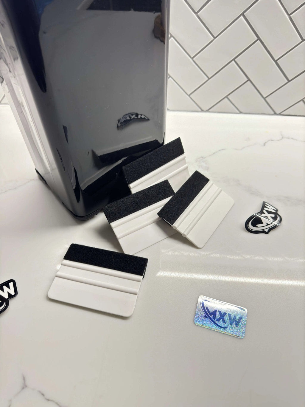 Microfiber squeegee accessory from MXwraps with a comfortable handle and flexible blade for efficient cleaning.