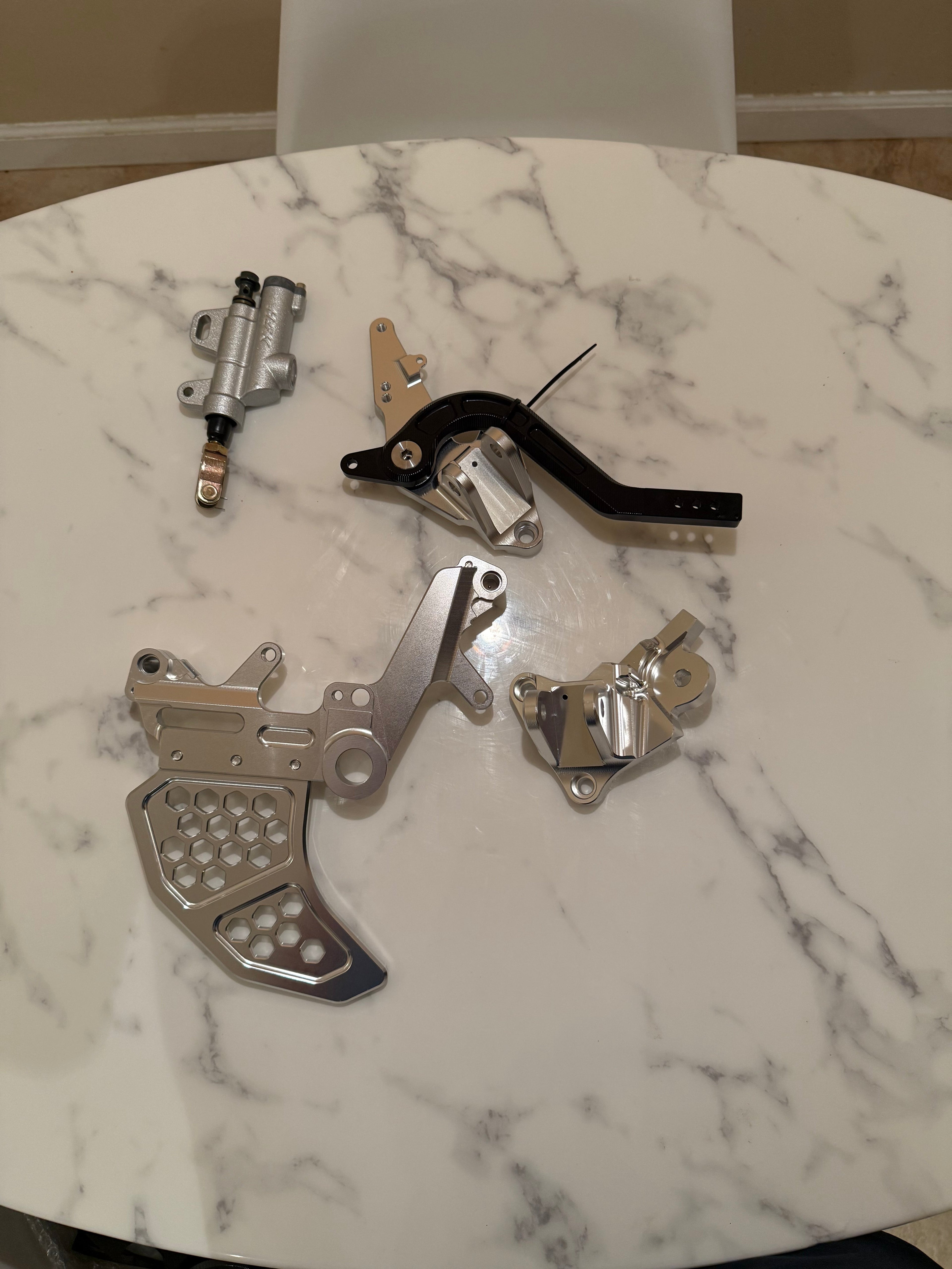Surgeracingco Surron Ultra Bee Footbrake Kit V3 with metal brake lever and hardware for electric bike braking system.