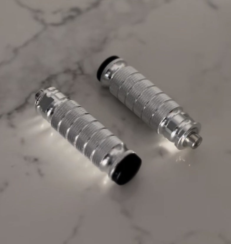 TG Racing replacement foot lock peg for scooters, showing a close-up of the durable metal peg with mounting hardware.