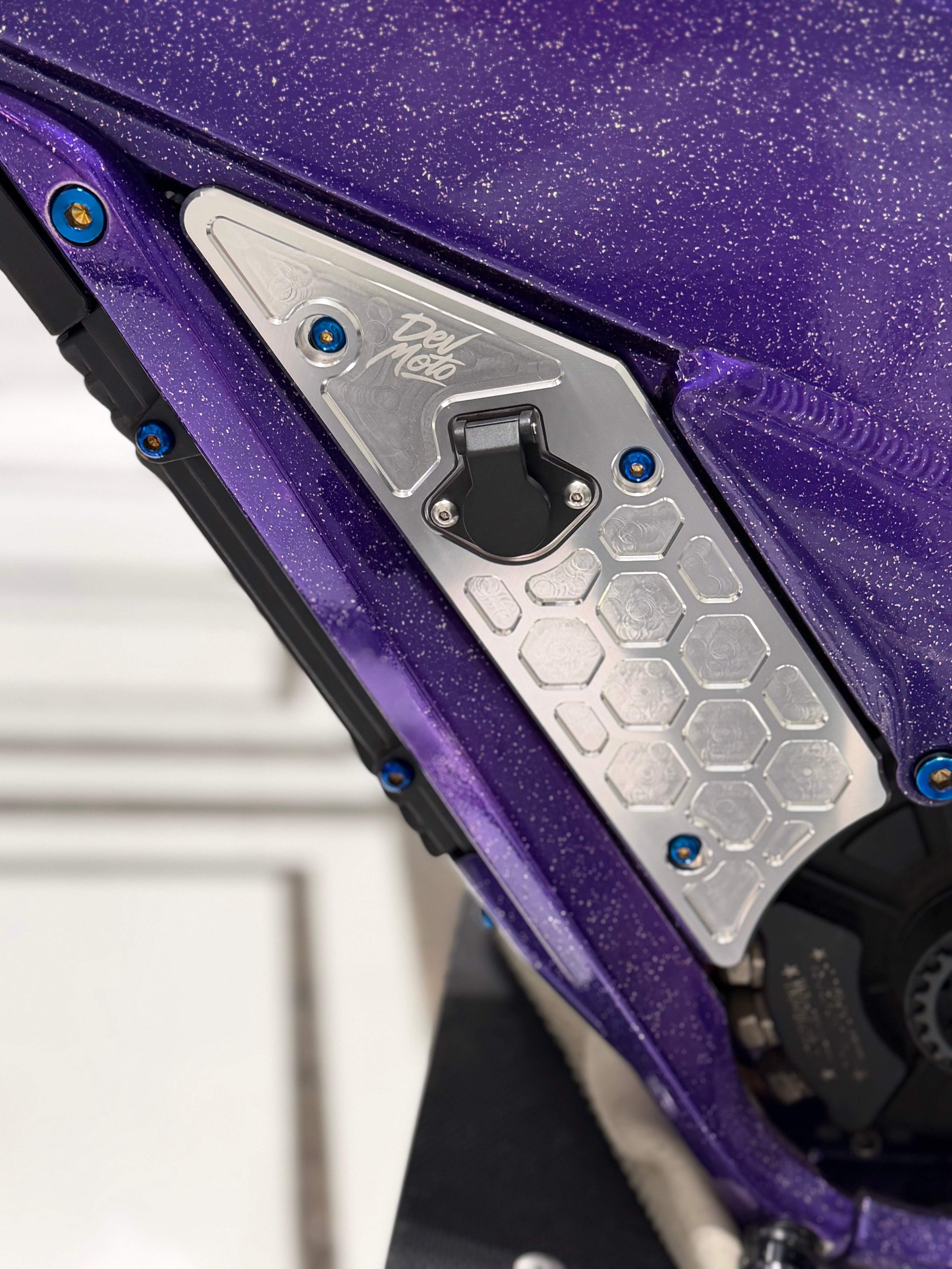 DevMoto Talaria side panel titanium bolts, set of 8, showing lightweight, durable fasteners with hex heads and sleek finish.