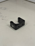 DevMoto Direct Mount Riser showing a sturdy black riser with mounting holes for motorcycle handlebars.