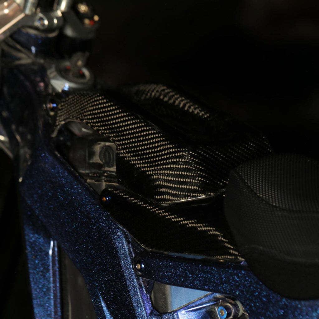 Modded Moto Co E-Ride Pro Carbon Fiber Battery Lid Lock for motorcycle, showcasing sleek black carbon fiber finish and secure locking mechanism.