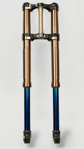 Modded Moto Co Pure Racing Surron Ultra/Talaria Komodo titanium suspension forks with lowers, showcasing sleek design and build quality.