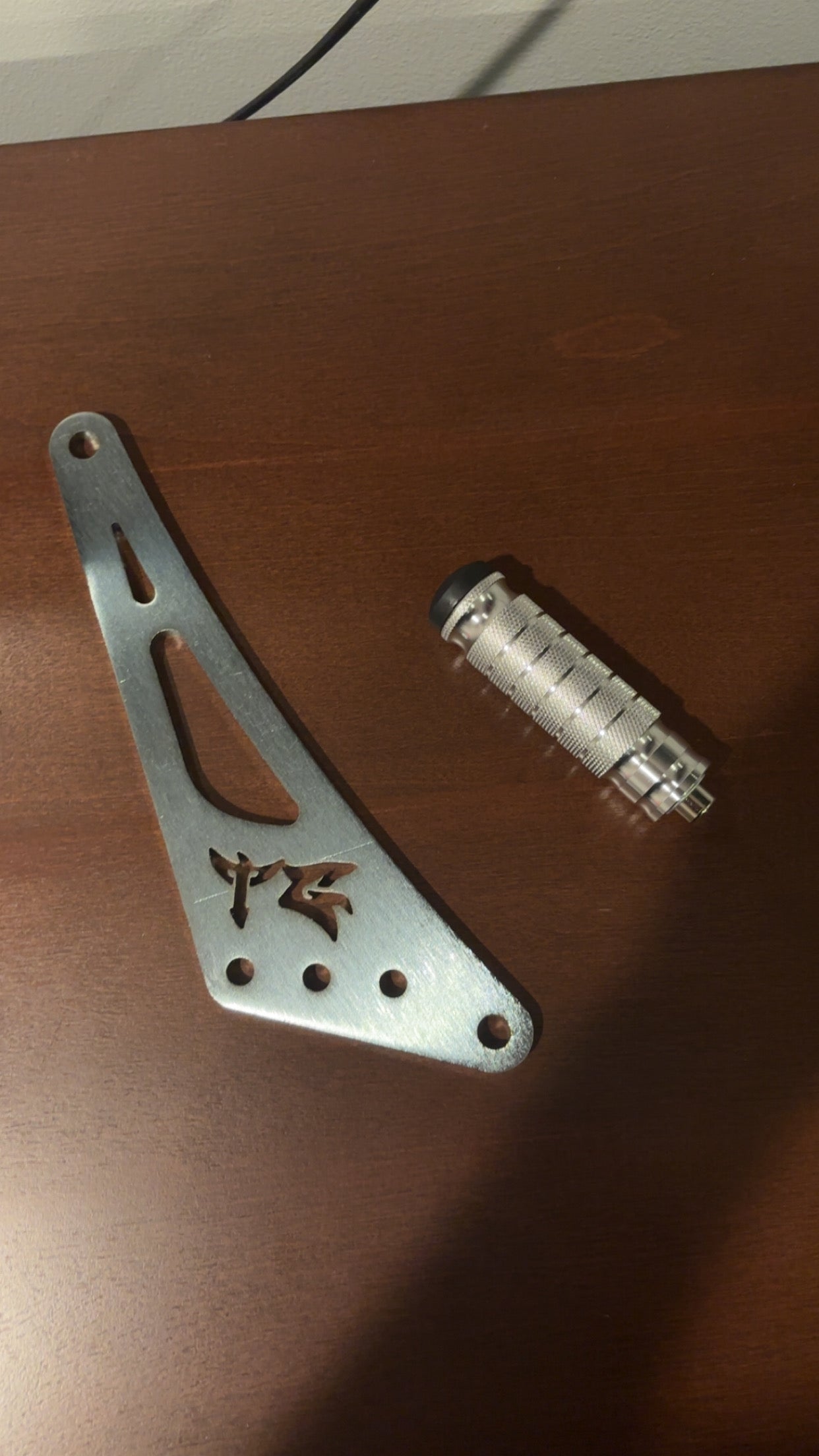 TG Racing Ultra Bee Shift Lock mounted on a gear shift lever for secure gear engagement in racing vehicles.