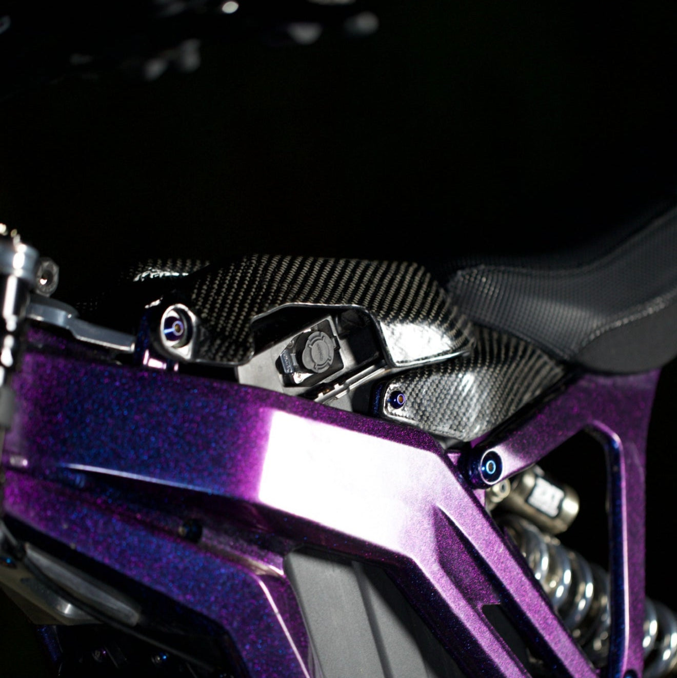 Modded Moto Co E-Ride Pro carbon fiber battery lid accessory, lightweight and durable for e-bike battery protection.