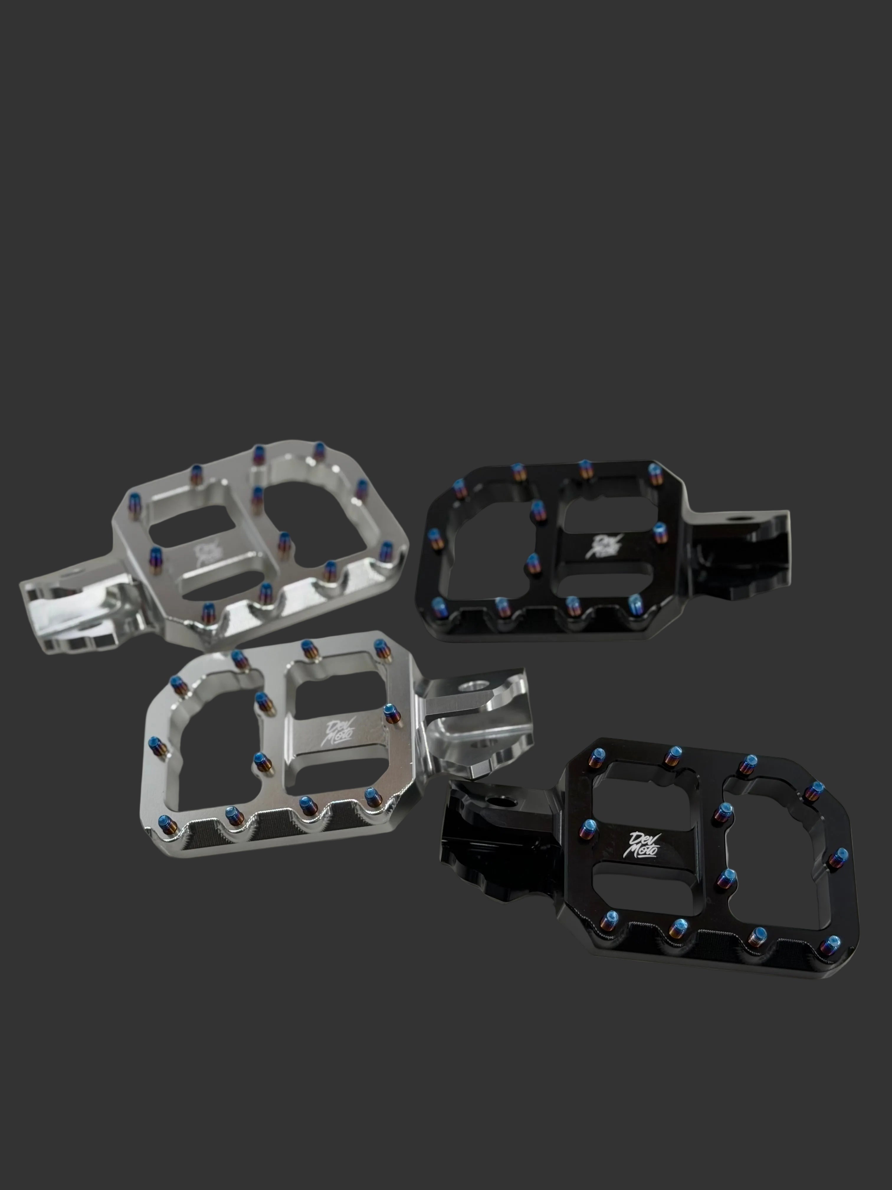 DevMoto E-Moto foot pegs for electric motorcycles, shown with durable metal construction and textured grip surfaces.