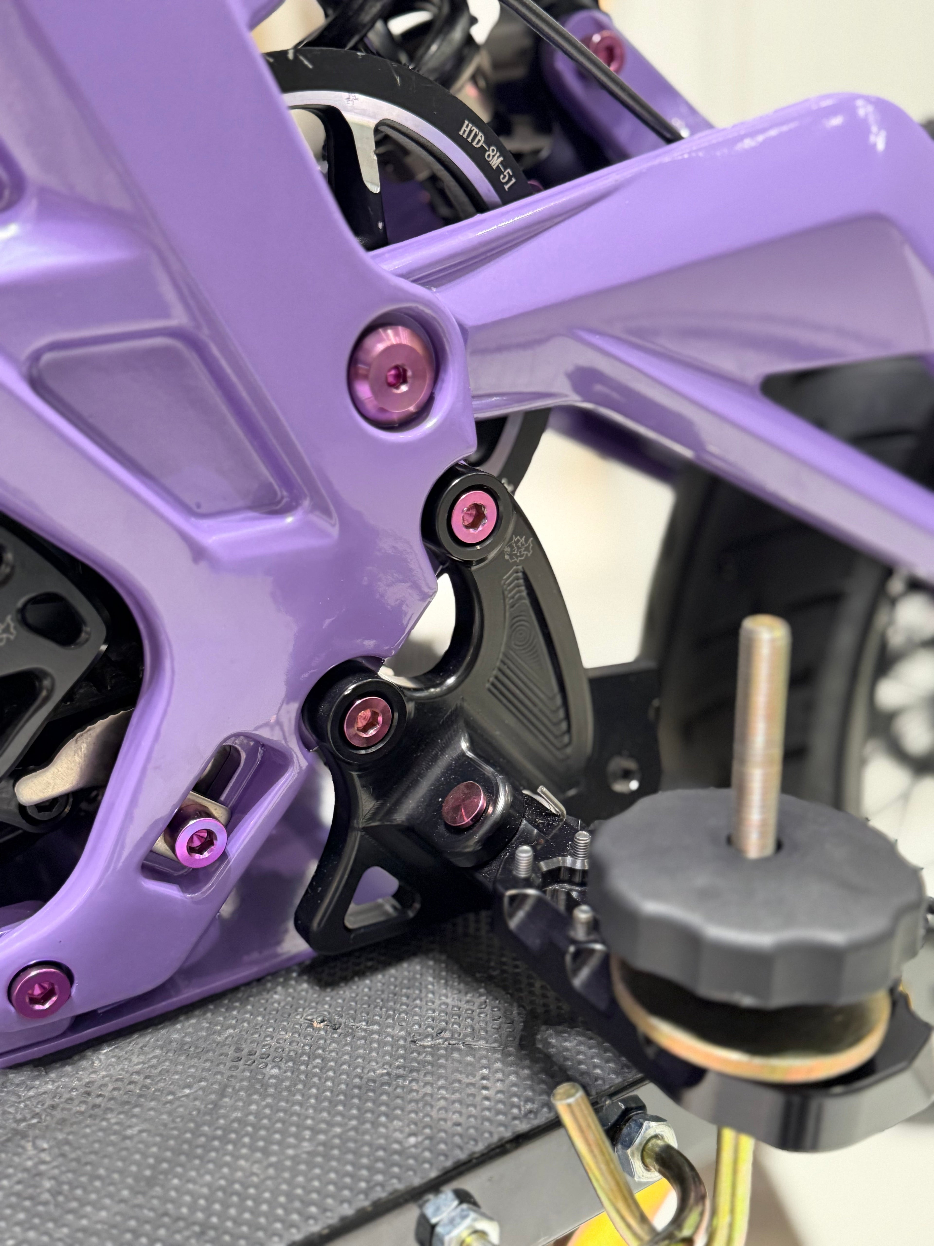 Set of four DevMoto All Emoto Peg Bracket Titanium Bolts with precision threading for motorcycle pegs and accessories.