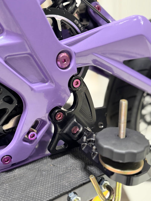 Set of four DevMoto All Emoto Peg Bracket Titanium Bolts with precision threading for motorcycle pegs and accessories.