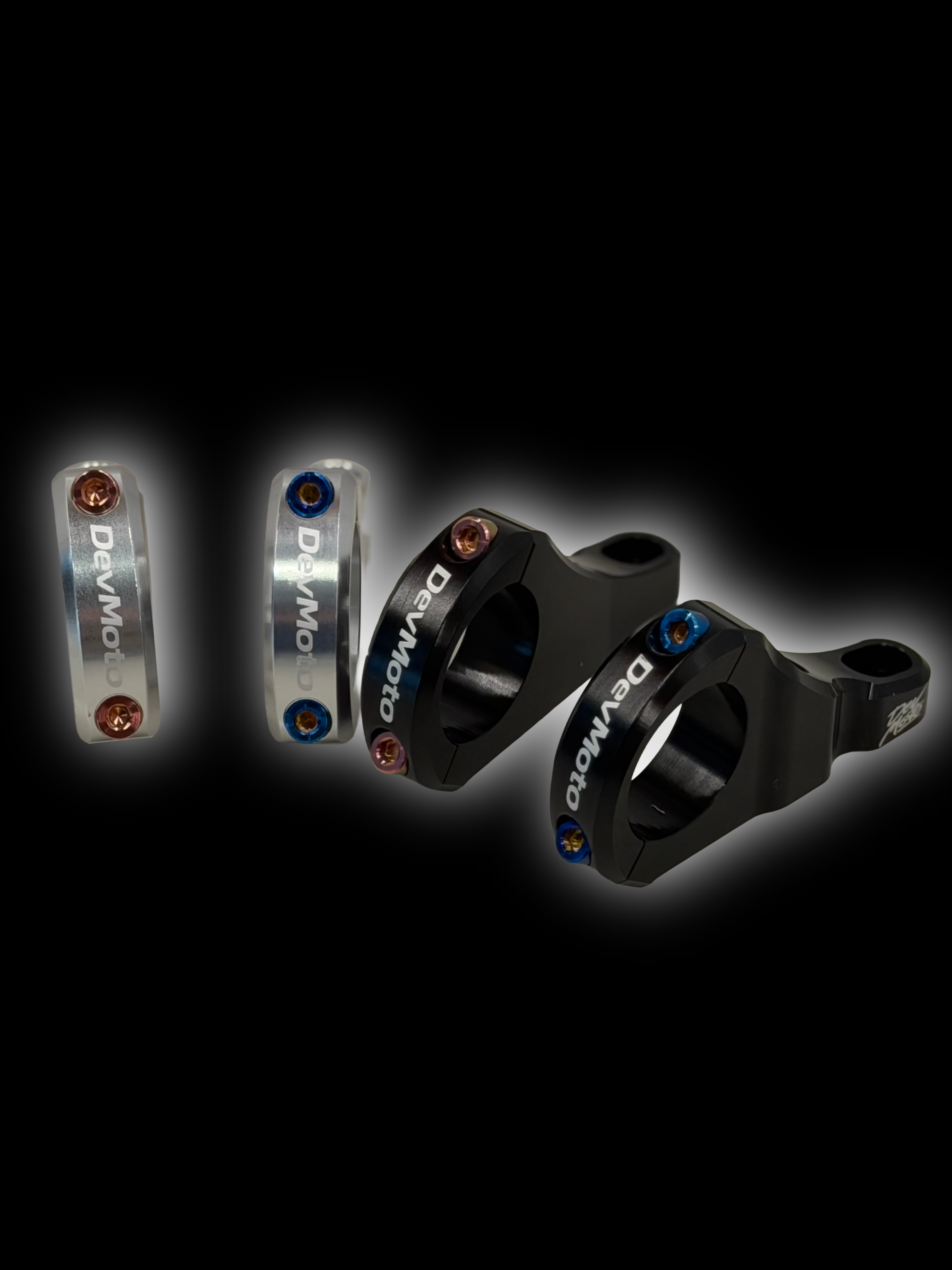 Set of four DevMoto Deity & DevMoto direct mount titanium bolts for mountain bike components, showcasing sleek, durable hardware.