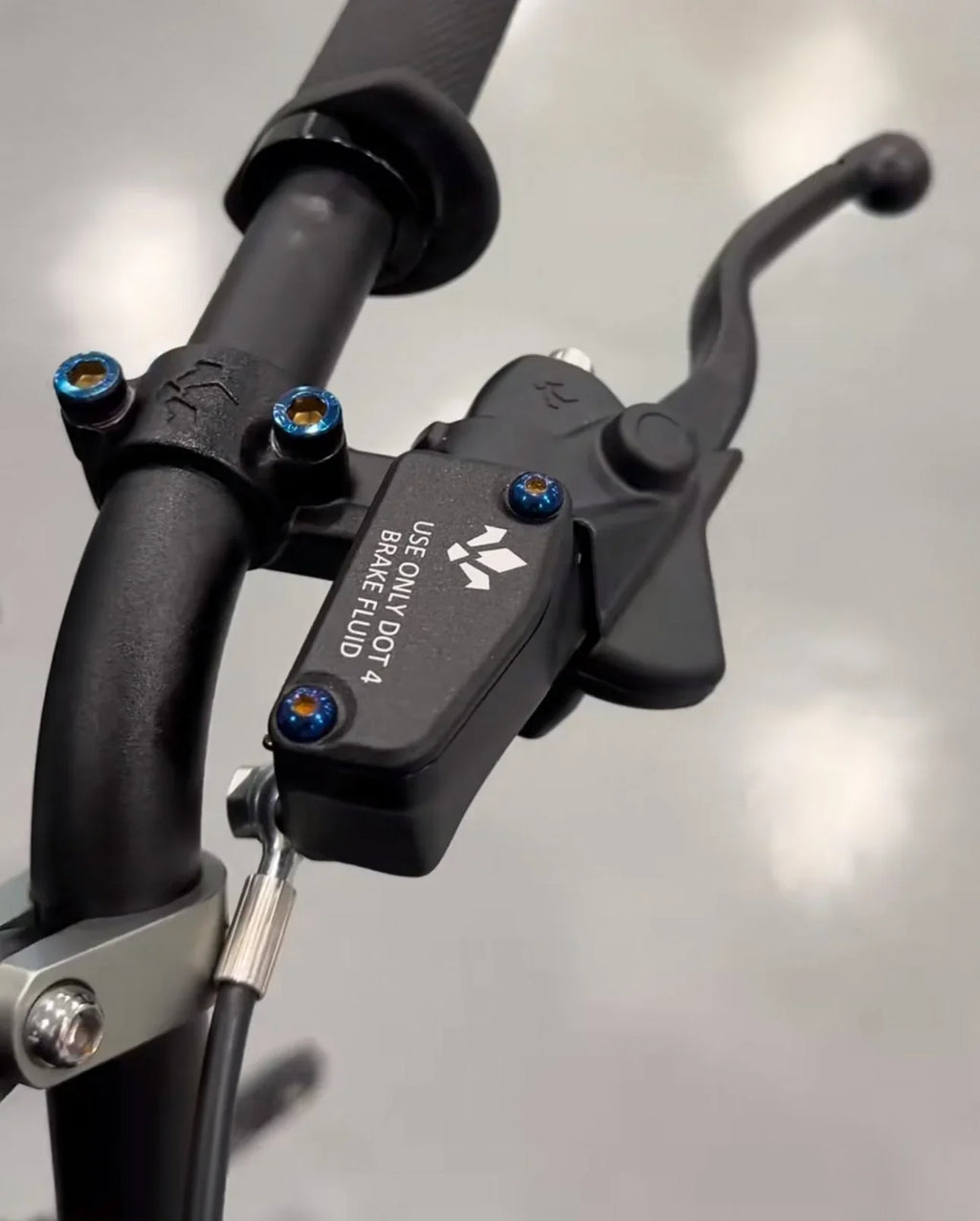 DevMoto Formula brake reservoir titanium bolts set, showing two sleek, lightweight bolts with precision threading and black finish.