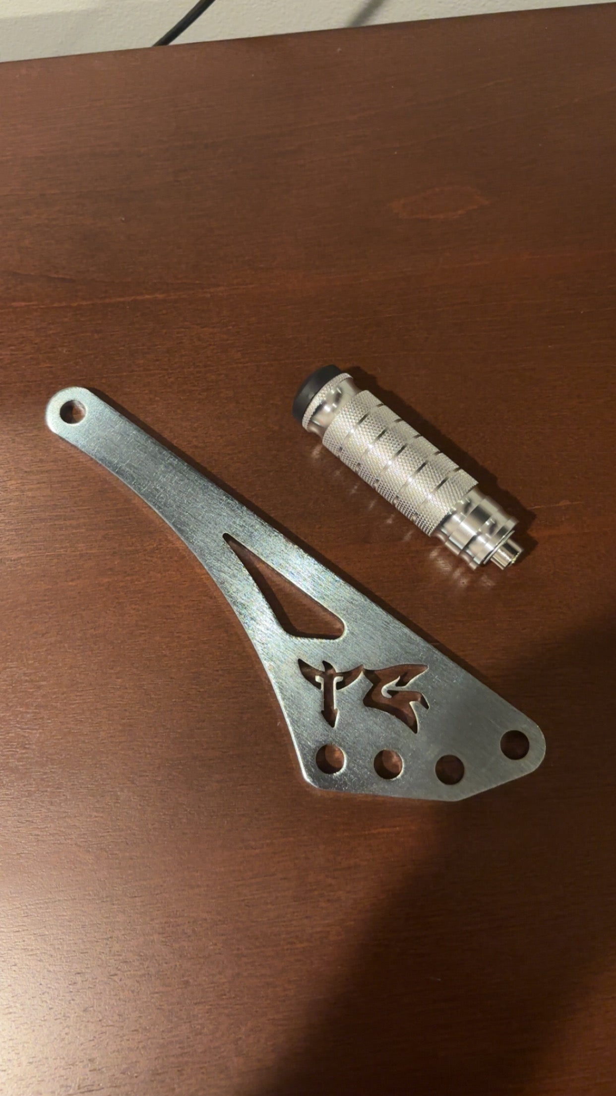 TG Racing Eride Pro Shiftlock motorcycle gear shift lock mounted on a bike, showcasing its durable metal construction and secure locking mechanism.