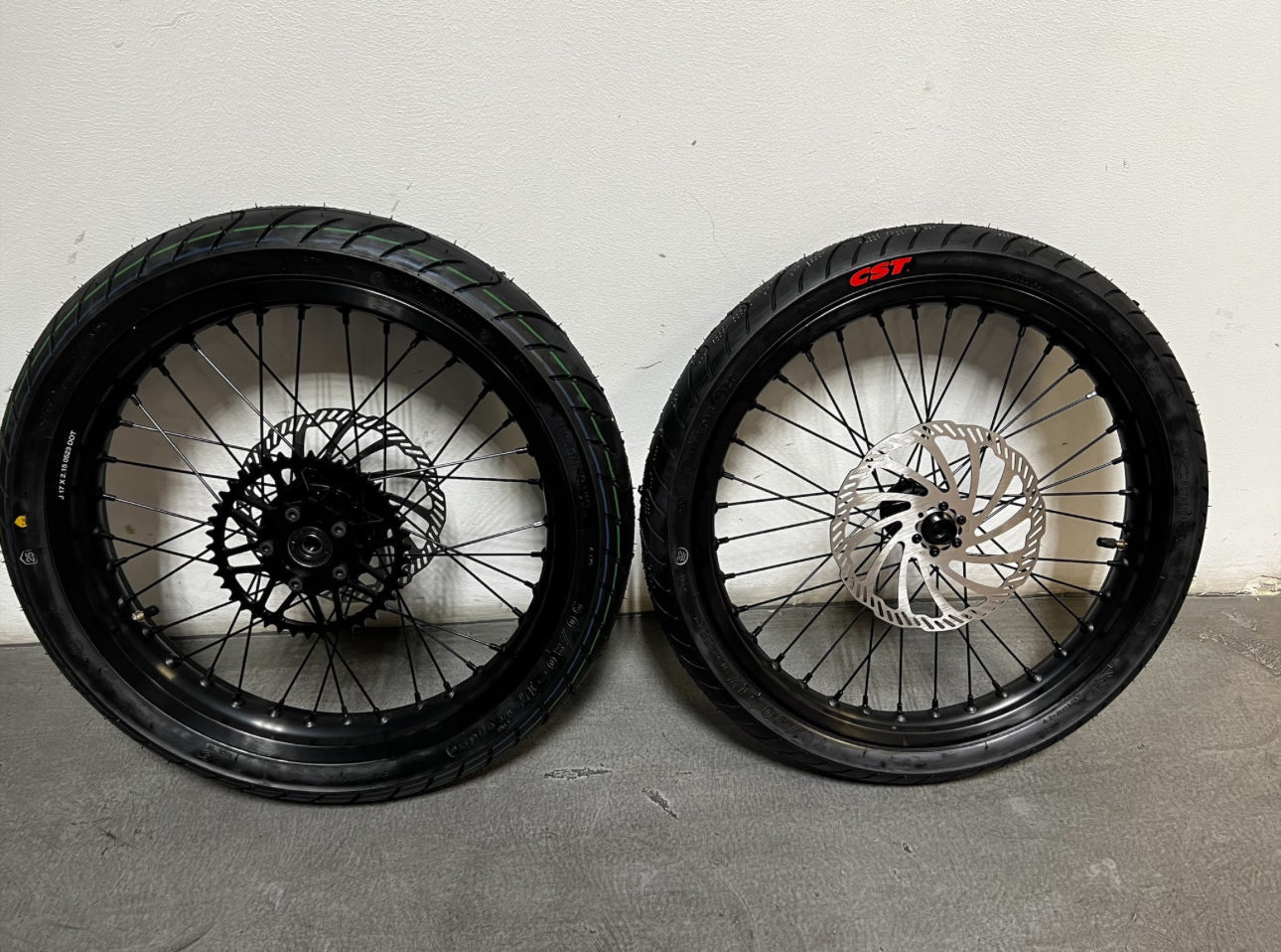 Emoto Flux 17-inch Surron/Eride Pro Super motos wheel with black tire and rim, designed for electric off-road bikes.