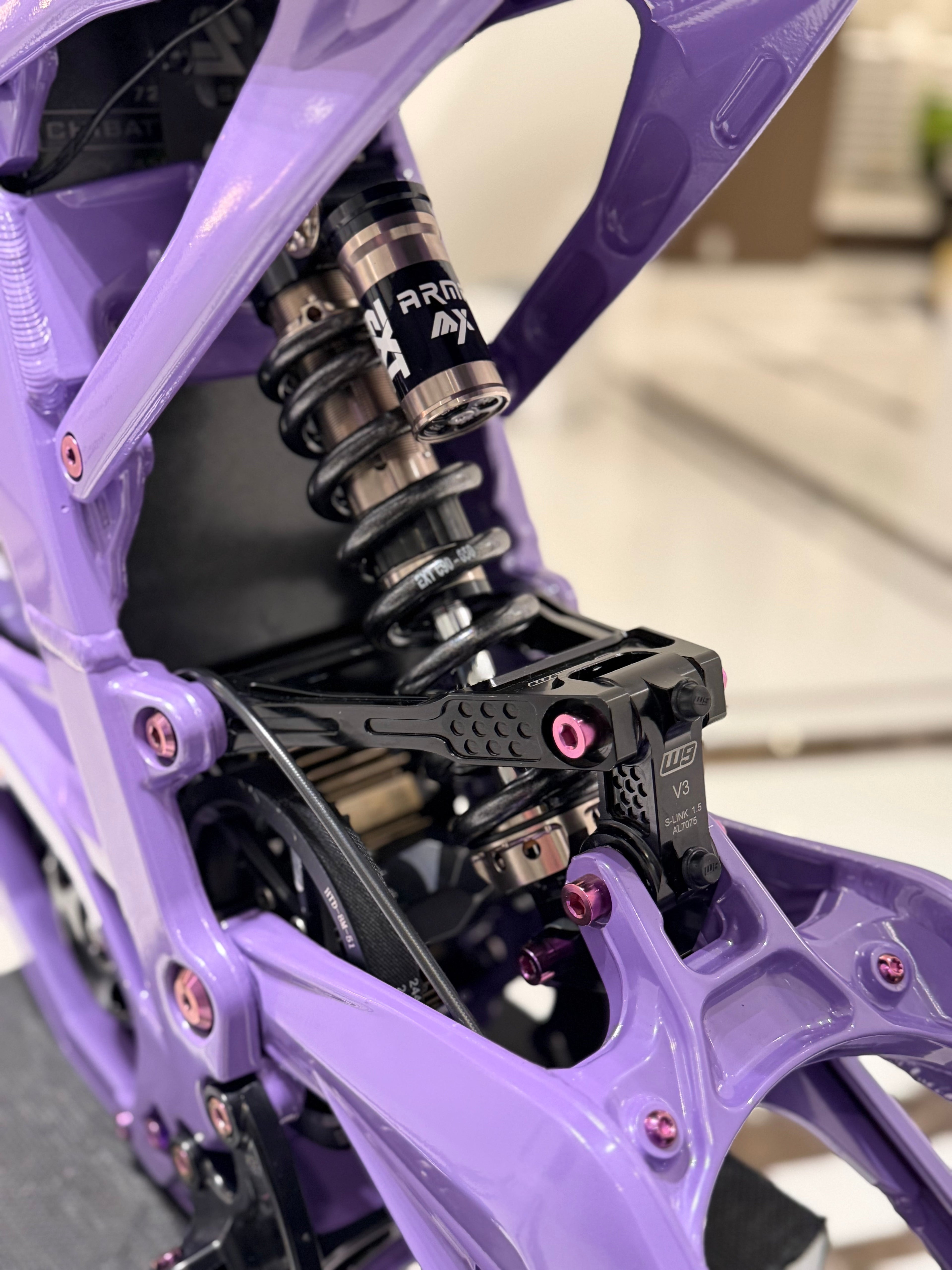 DevMoto titanium rear suspension and linkage bolts and nuts kit for Surron LBX, set of 10, showing shiny metal hardware.