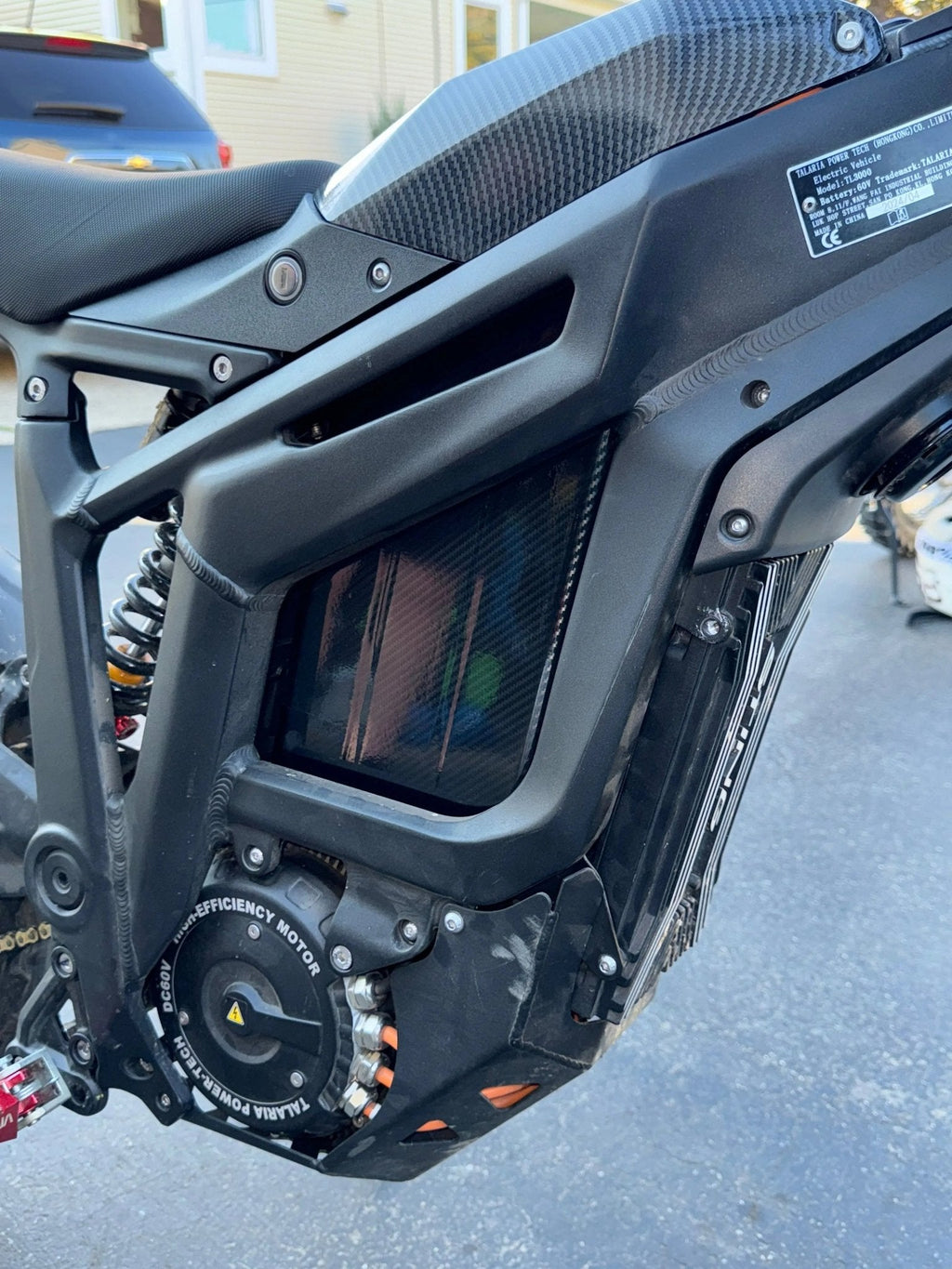 MXwraps carbon fiber E-bike battery wrap with vinyl finish, showcasing sleek, durable design on a bike battery.
