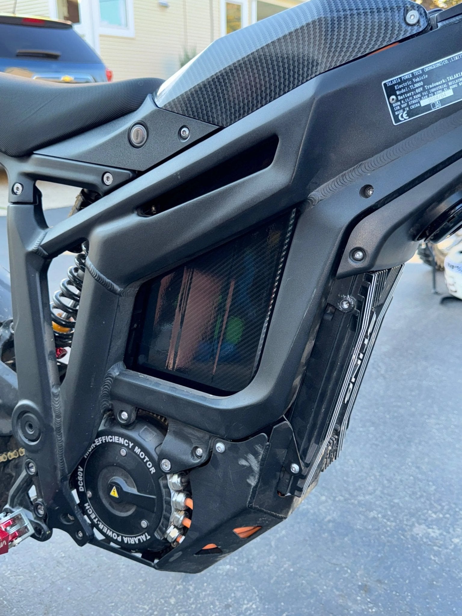 MXwraps carbon fiber E-bike battery wrap with vinyl finish, showcasing sleek, durable design on a bike battery.