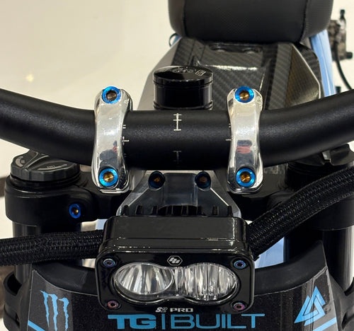 DevMoto direct mount titanium bolts shown, lightweight and durable fasteners for motorcycle performance and reliability.