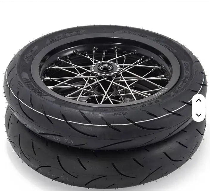 Tiboltco supermotos spokes for all mini emotos, close-up view of shiny metal spokes on mini motorcycle wheel.