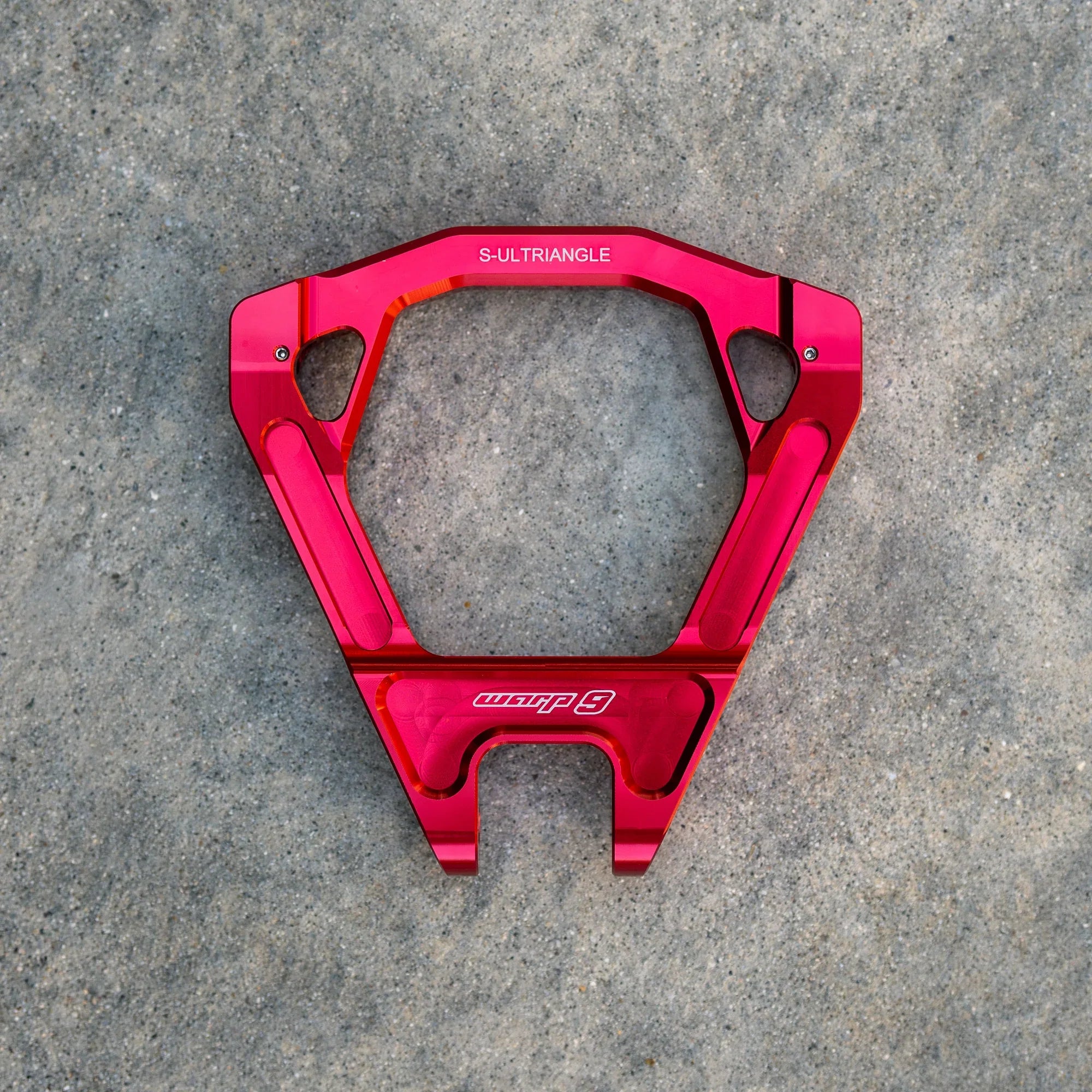 Warp 9 Surron Ultra Bee triple clamps and linkage by Modded Moto Co, showcasing sturdy motorcycle suspension components.