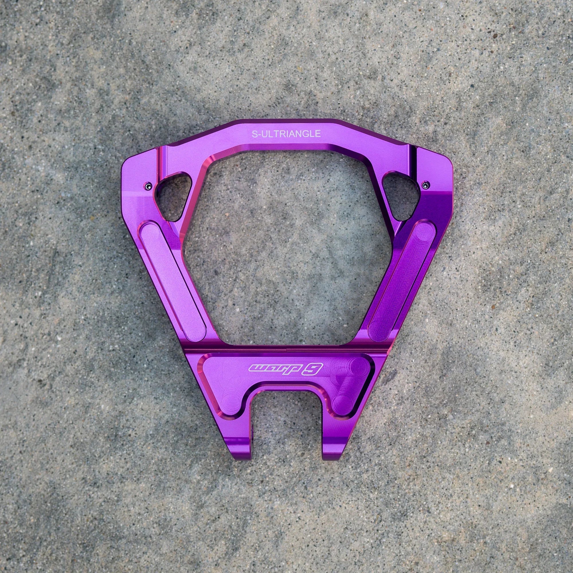 Warp 9 Surron Ultra Bee triple clamps and linkage by Modded Moto Co, showing polished metal components with mounting points.
