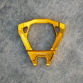 Warp 9 Surron Ultra Bee triple clamps and linkage from Modded Moto Co, showing polished metal components on a white background.