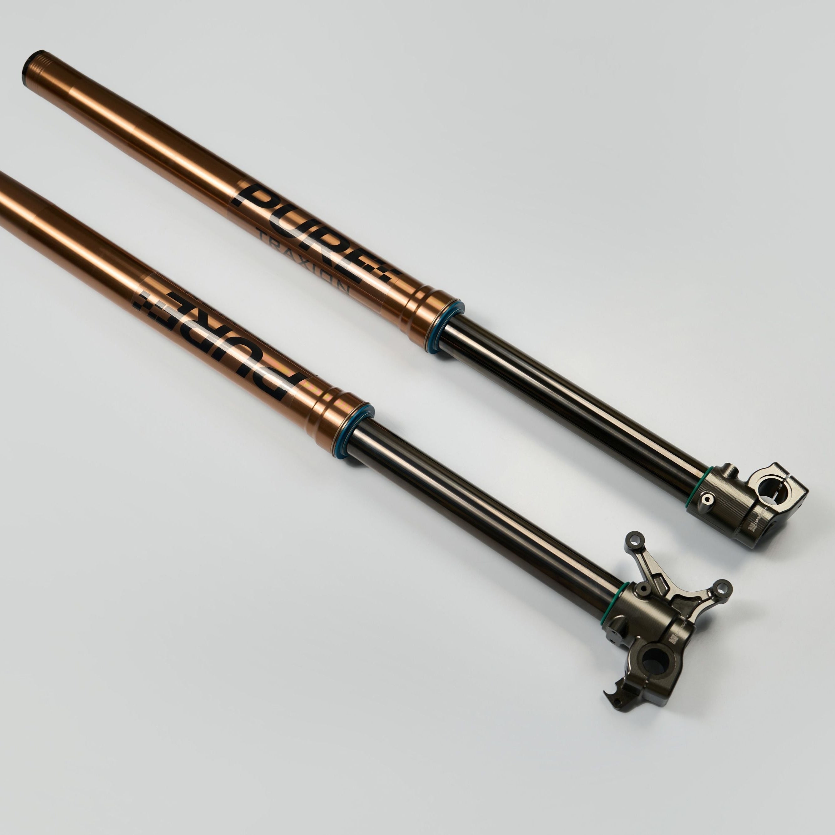 Modded Moto Co Pure Racing Surron Ultra and Talaria Komodo suspension forks on a motorcycle for enhanced off-road performance.