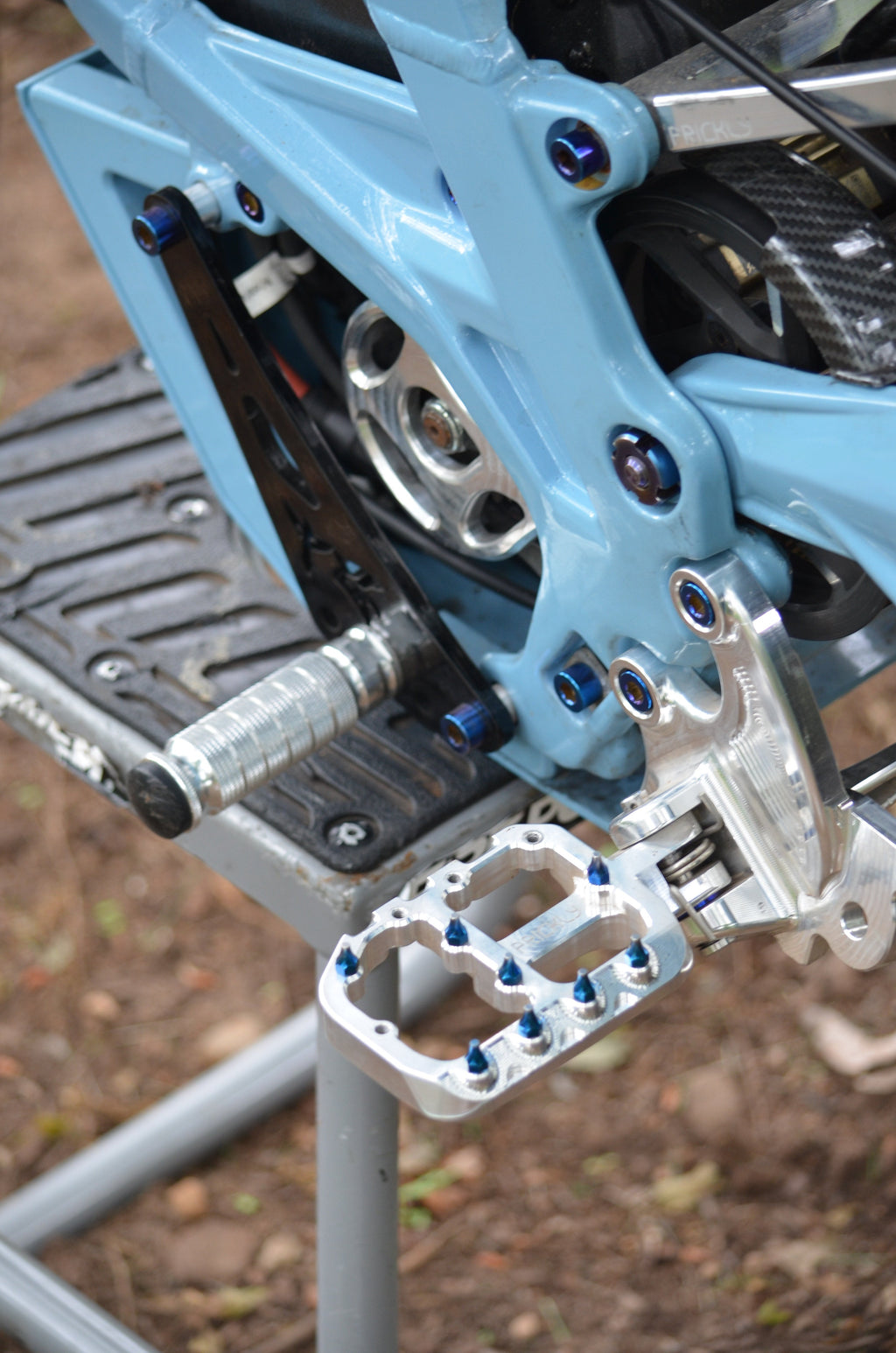 TG Racing Surron LBX Shiftlock device attached to electric bike, showcasing the gear shift lock mechanism on DSC_0017.jpg.
