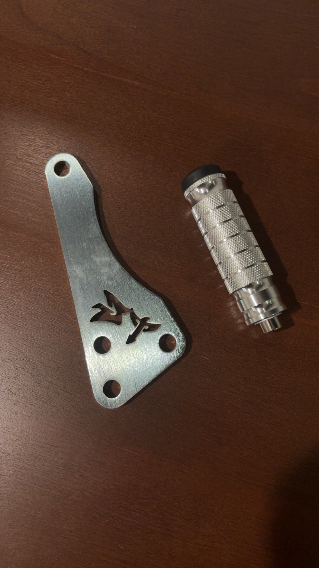 TG Racing Talaria X3 footlock and bracket mounted on an automotive chassis for secure suspension setup.