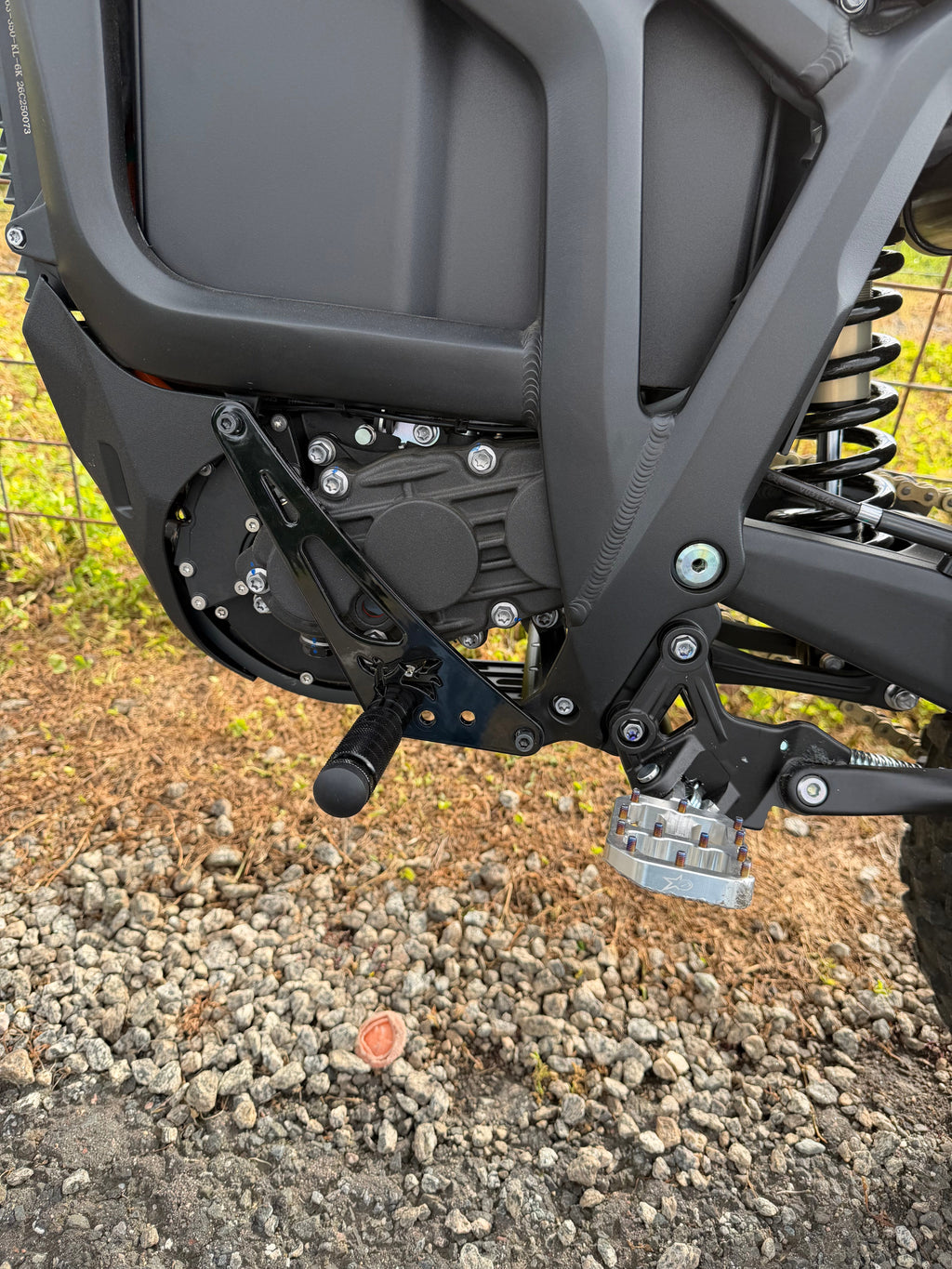 Talaria Komodo Shift Lock by TG Racing, durable black metal gear shift lock with key for motorcycle security.