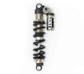 Modded Moto Co EXT Arma MX rear shock absorber for motocross bikes, showcasing its sturdy build and mounting points.