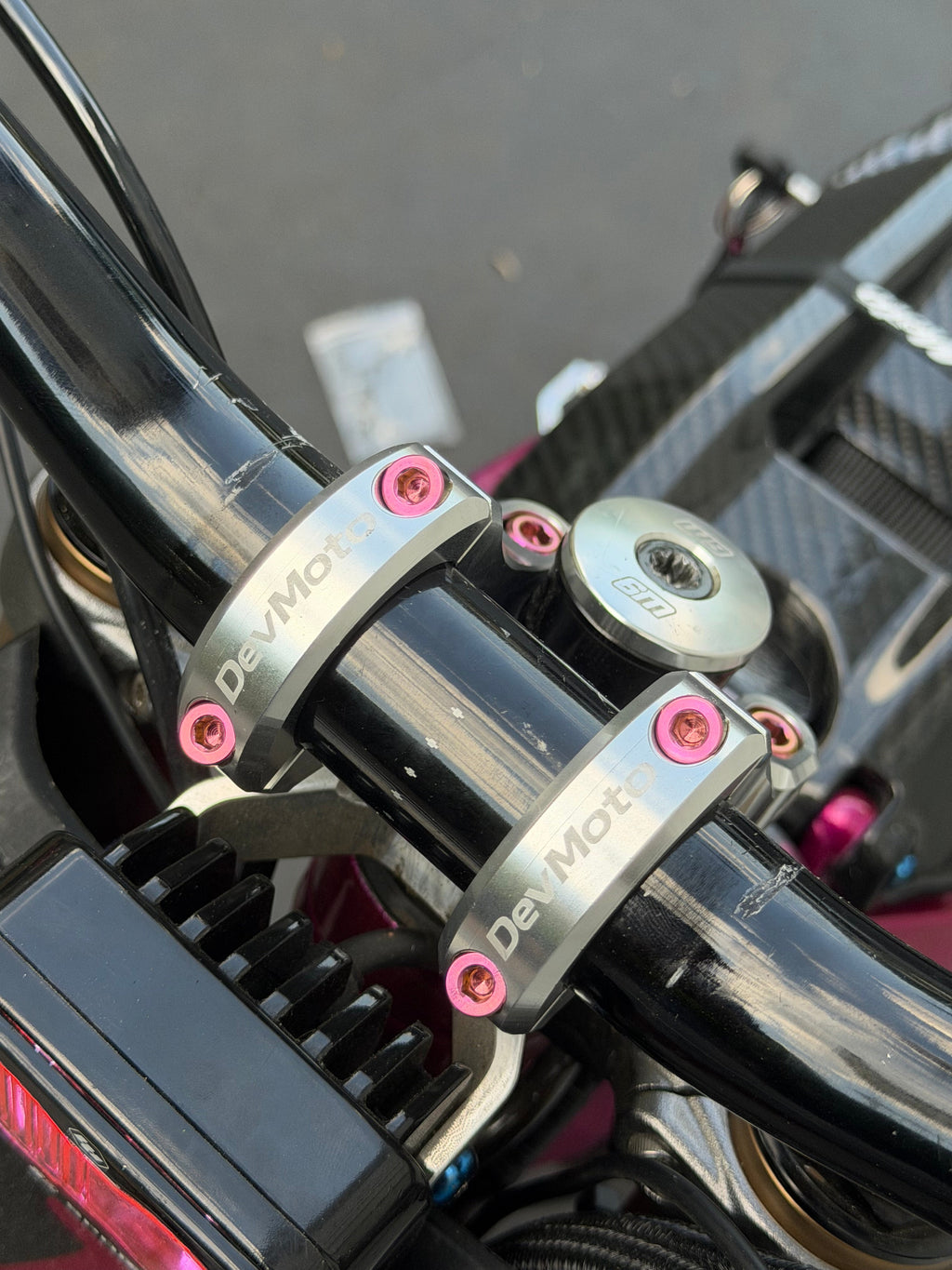 Set of four DevMoto Deity & DevMoto direct mount titanium bolts for mountain bike handlebars and stems.