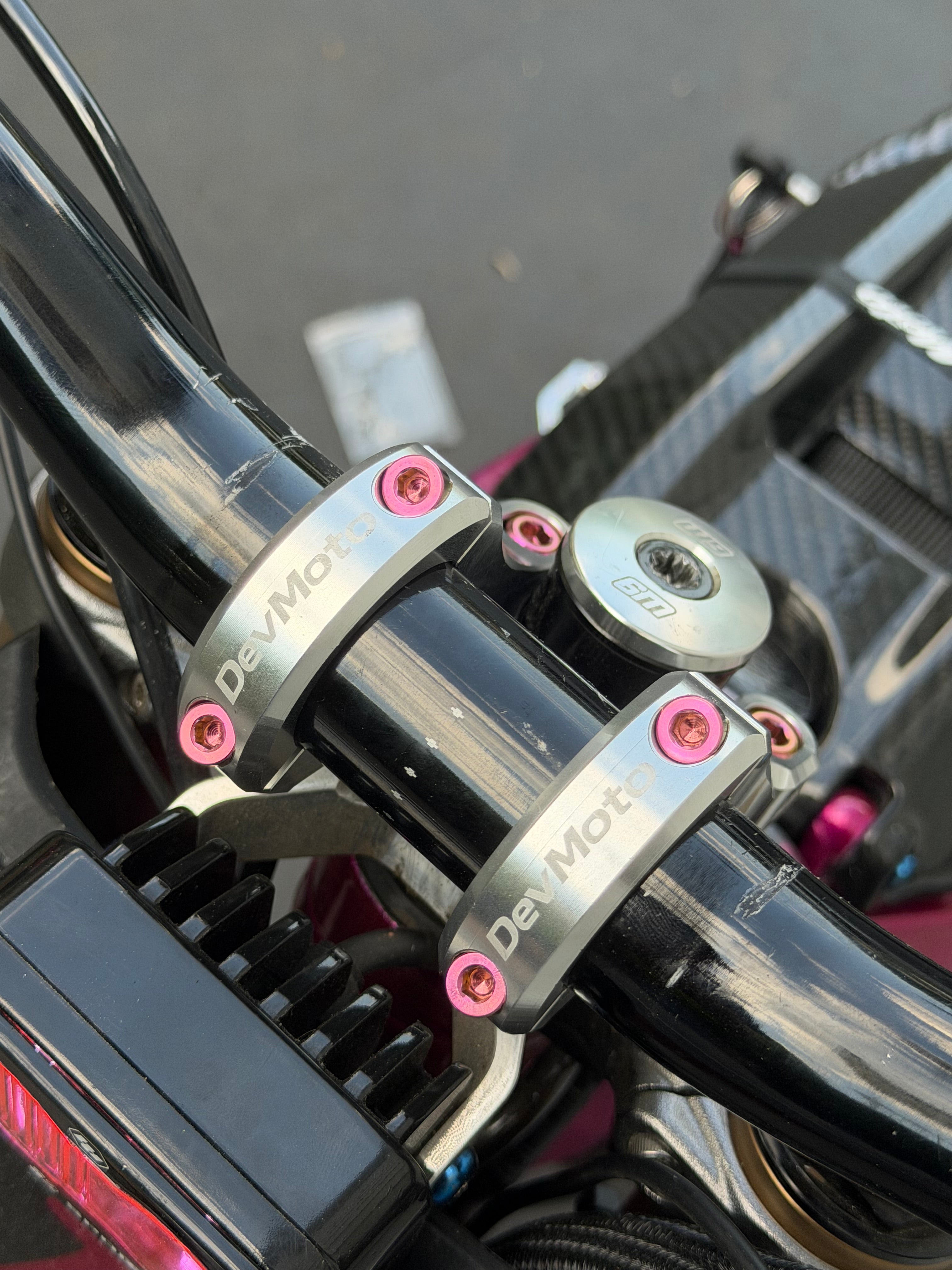 Set of four DevMoto Deity & DevMoto direct mount titanium bolts for mountain bike handlebars and stems.