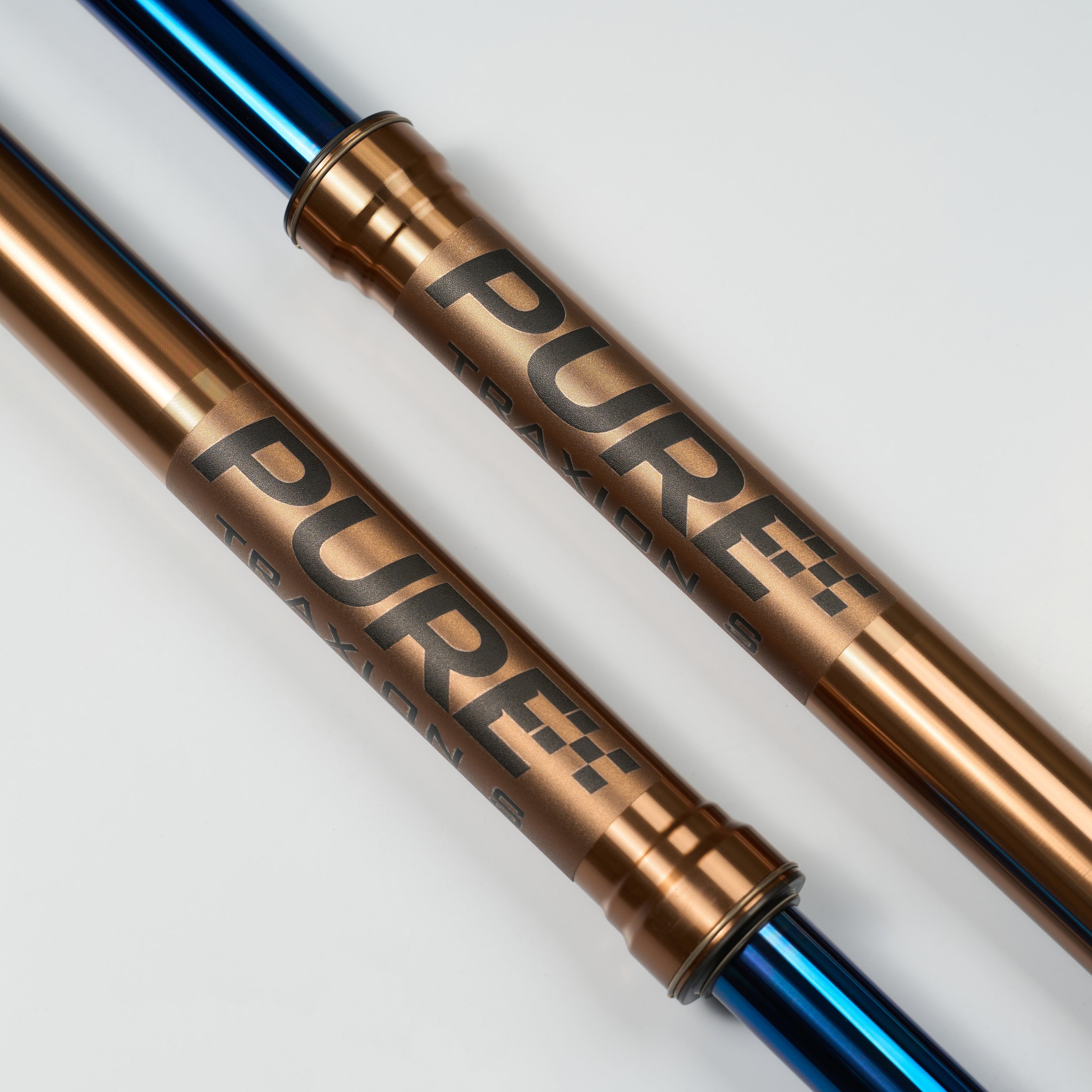 Modded Moto Co Pure Racing Surron Ultra/Talaria Komodo titanium fork suspension with sleek lowers, detailed view of high-performance components.