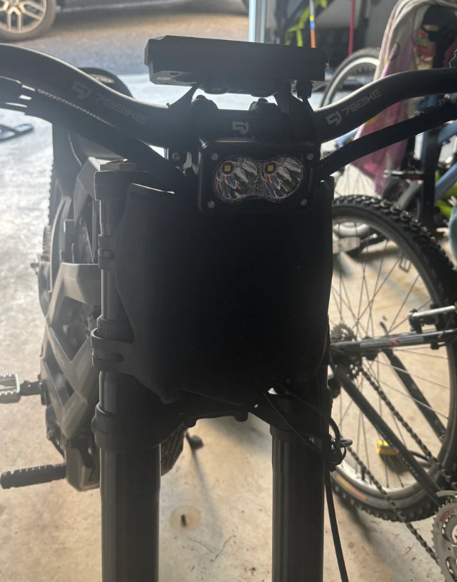 79mods Surron Baja plug and play electric bike with sleek frame and off-road tires, ready for adventure.