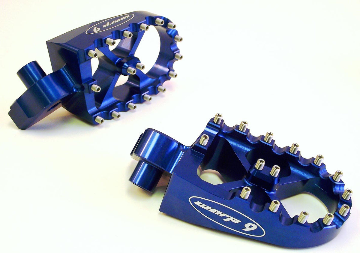 Modded Moto Co Warp 9 Talaria and Sigma foot pegs mounted on motorcycle, showcasing durable metal construction and sleek design.