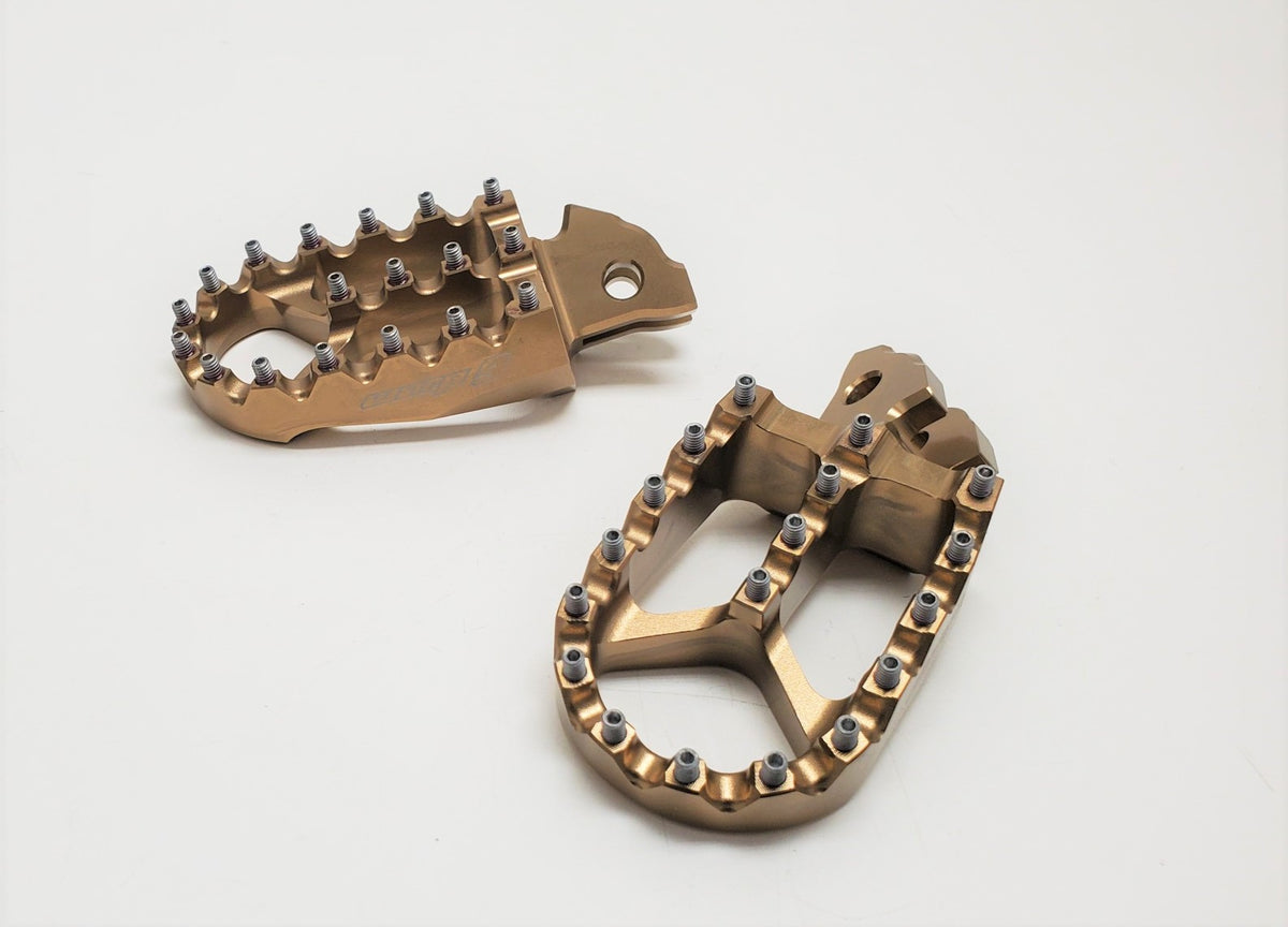 Modded Moto Co Warp 9 Talaria and Sigma foot pegs mounted on motorcycle, featuring durable metal construction and textured surfaces.
