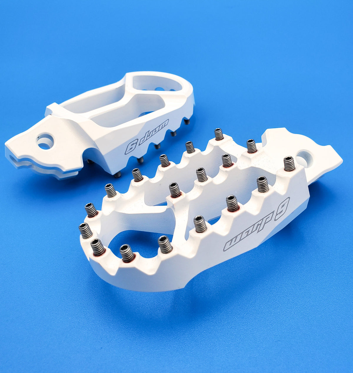 Modded Moto Co Warp 9 Talaria and Sigma foot pegs for motorcycle, close-up view of durable metal foot pegs with textured surface.