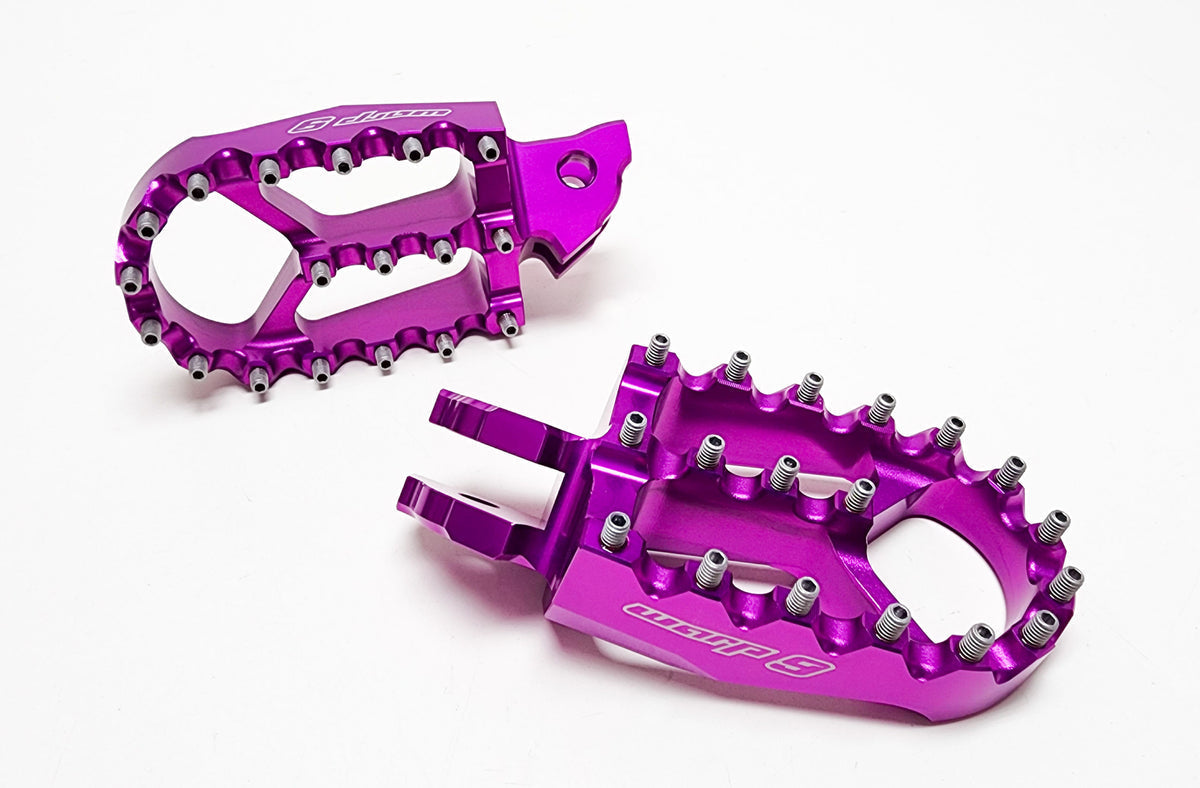 Modded Moto Co Warp 9 Talaria and Sigma foot pegs for motorcycles, featuring durable metal construction and textured surfaces.