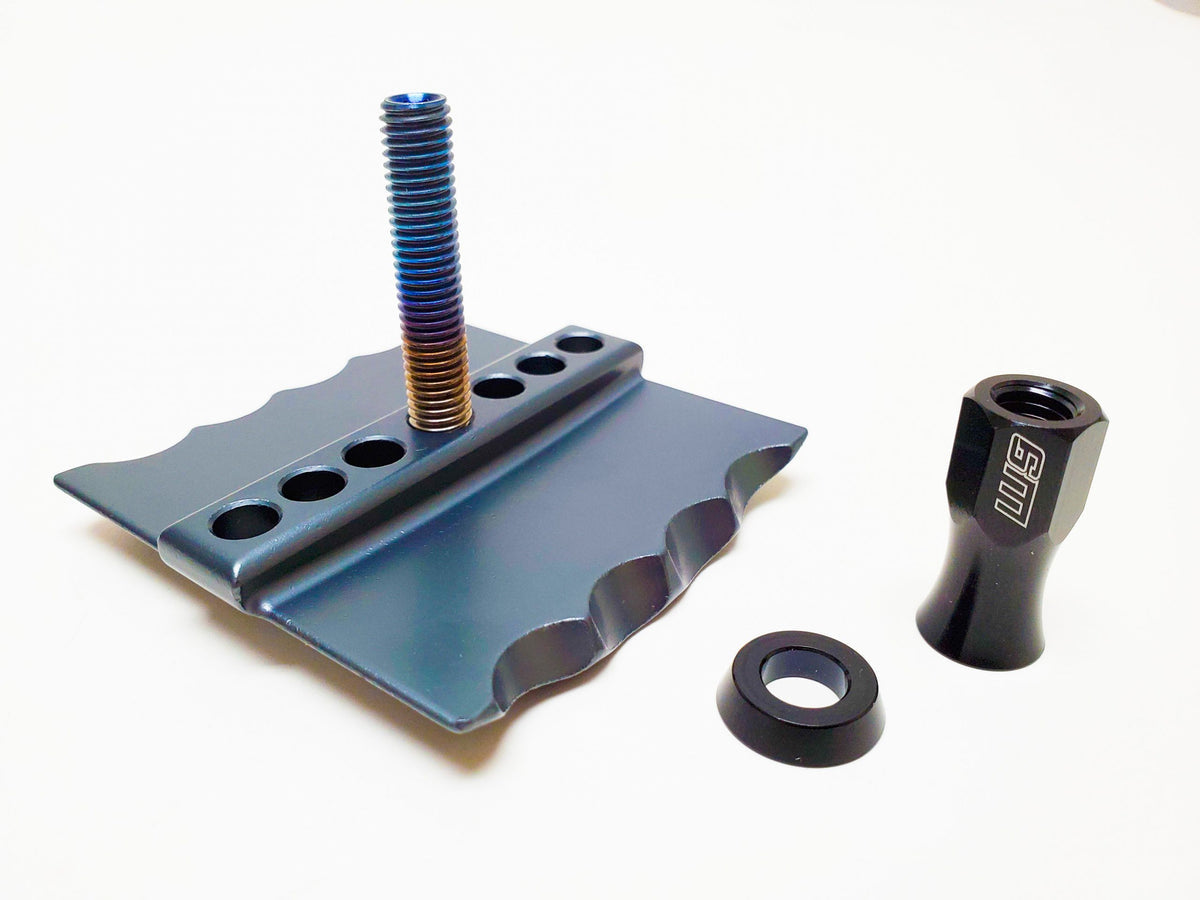 Modded Moto Co Warp 9 Titanium Pro Rim Locks accessory with durable titanium construction, designed for motorcycle wheel security.
