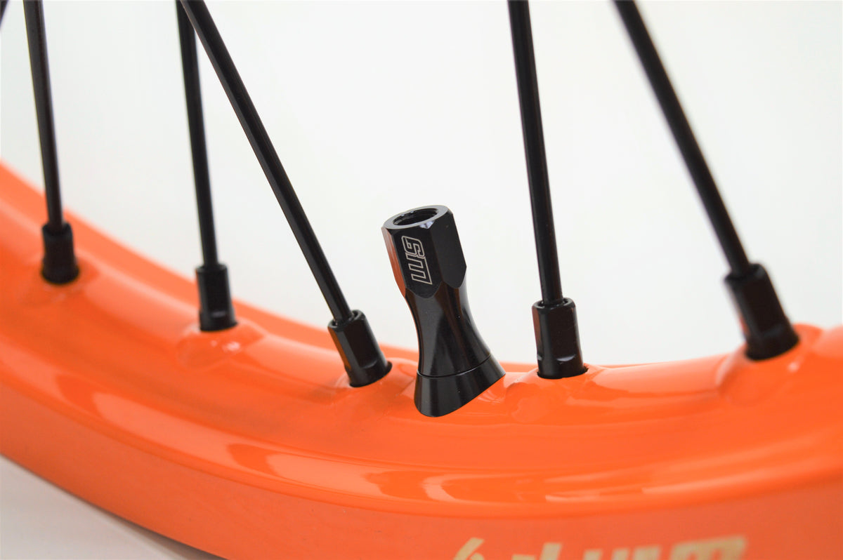Warp 9 Titanium Pro Rim Locks accessory by Modded Moto Co, featuring durable titanium construction and secure locking mechanism.
