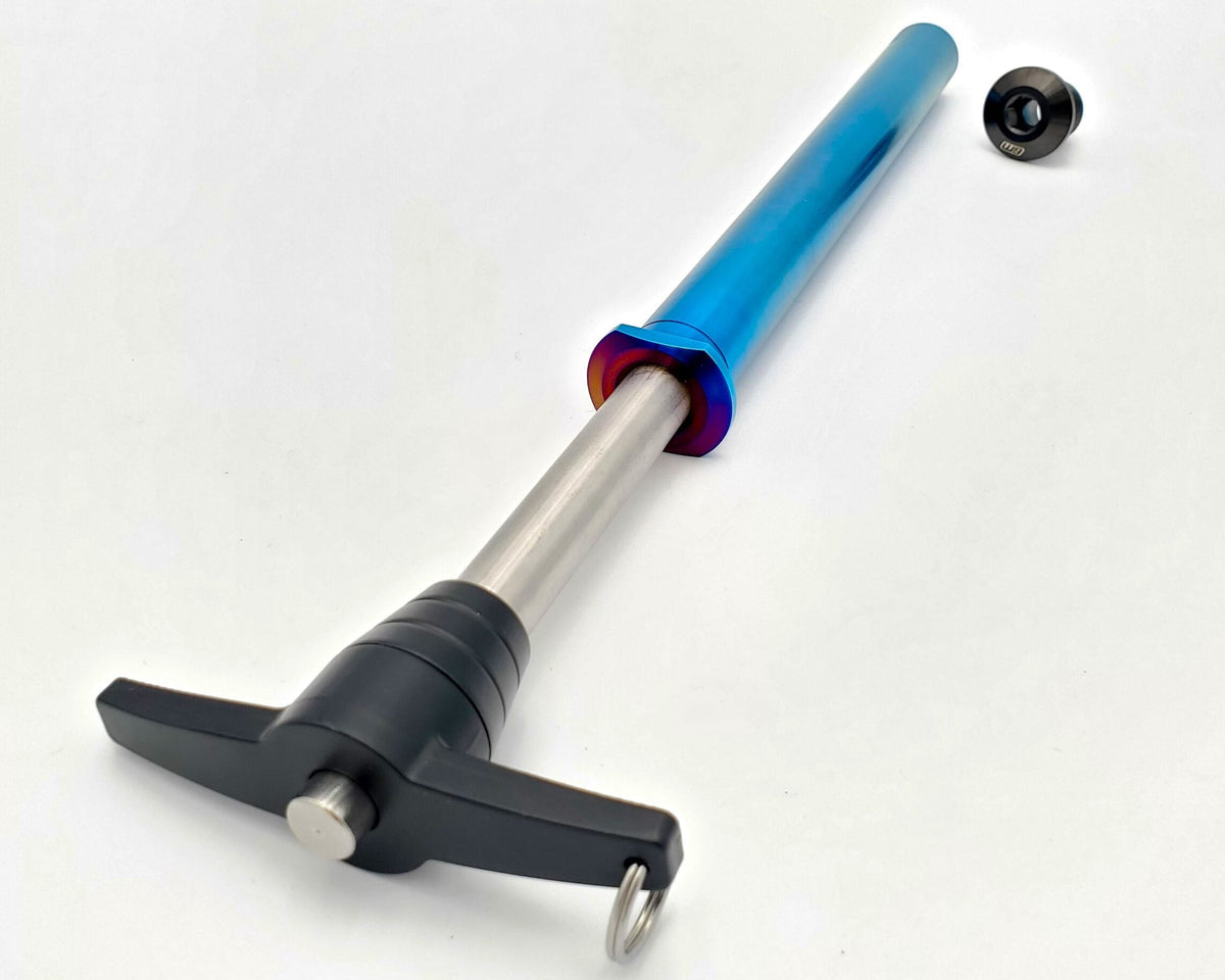 Warp 9 Stark Varg titanium rear axle kit by Modded Moto Co, showcasing a durable, lightweight motorcycle axle on a neutral background.