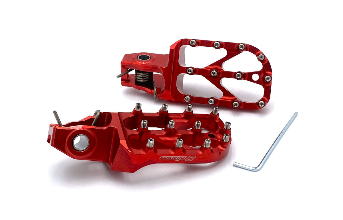 Warp 9 Stark Varg Elite foot pegs by Modded Moto Co, durable motorcycle foot pegs with a textured surface for grip.