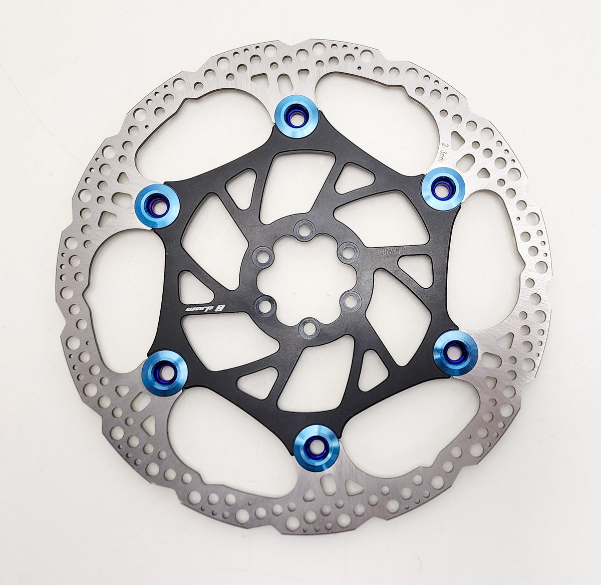 Rear Warp 9 brake rotor by Modded Moto Co, showcasing a high-performance motorcycle brake rotor with vented design.
