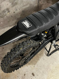 MXwraps Talaria Mx3/Mx4 carbon fiber vinyl wrap kit with black and gray textured finish on a car surface.