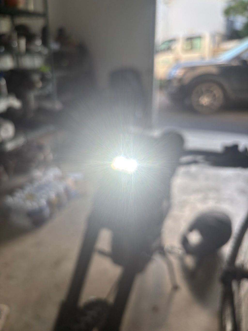 79mods 79Bike Baja Light mounted on a bicycle, showcasing its compact design and bright LED illumination for off-road cycling.