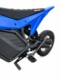 TG Racing RTR shift lock device shown in black with metal components, designed to secure gear shifts in racing vehicles.