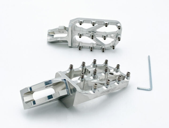 Warp 9 Ultra Bee Elite foot pegs by Modded Moto Co for motorcycle, featuring durable metal construction and non-slip surfaces.