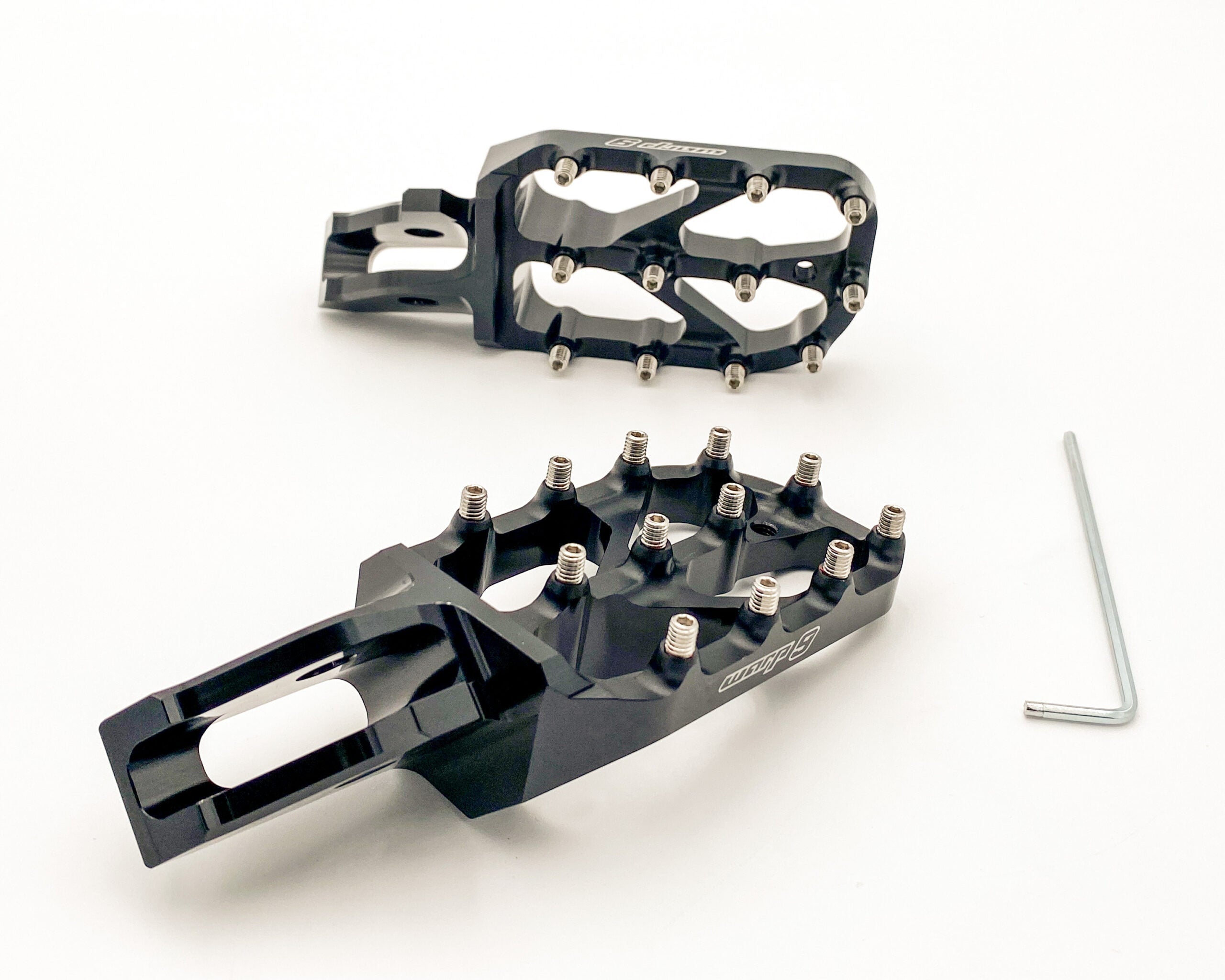 Modded Moto Co Warp 9 Ultra Bee Elite foot pegs for motorcycle, featuring durable metal construction and textured surface for grip.