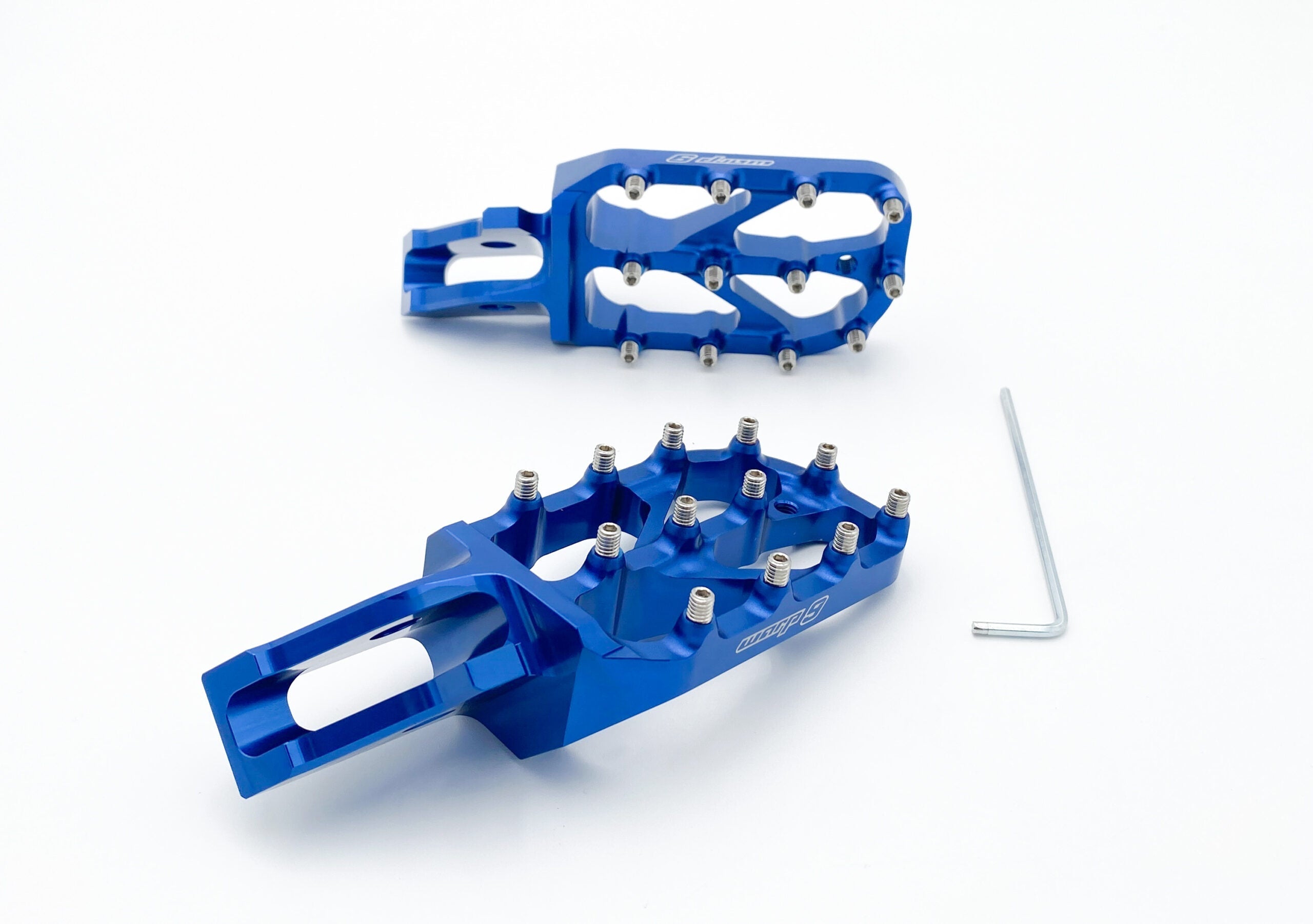 Modded Moto Co Warp 9 Ultra Bee Elite foot pegs for motorcycle, featuring durable metal construction and textured grip surface.